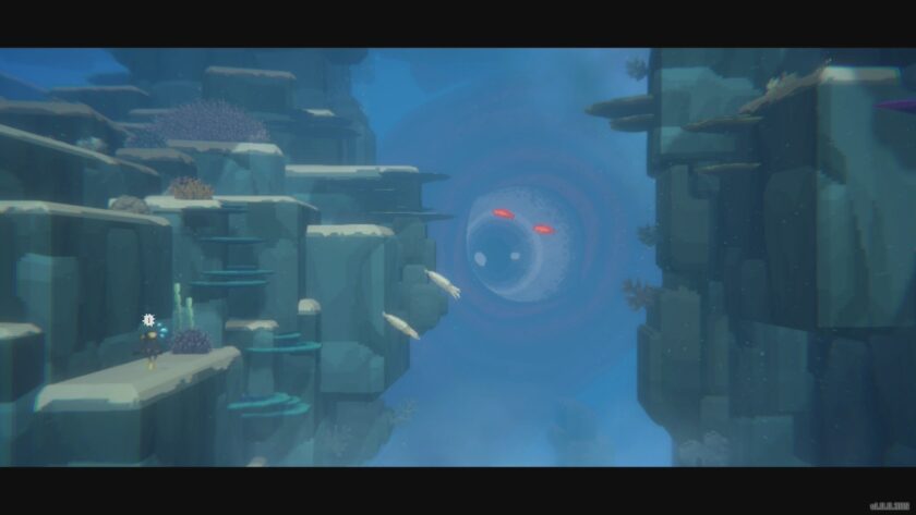 An underwater scene in Dave the Diver, with two red eyes glowing in the dark.