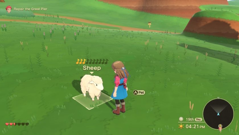The game character with a sheep she found in the wild, petting it