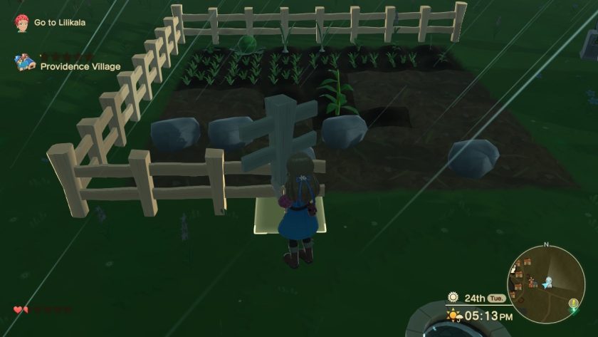 The game protagonist is busy building a white picket fence around the field