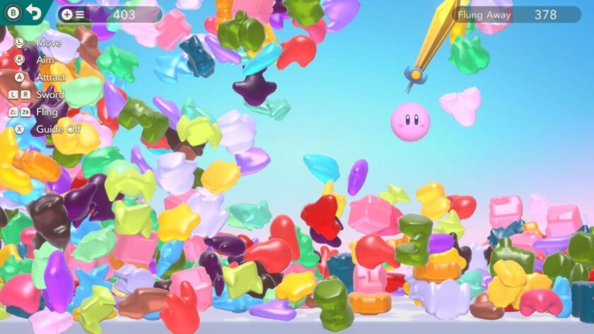A large mountain of gummies with Kirby holding a sword flinging them out of the way. Published on LadiesGamers