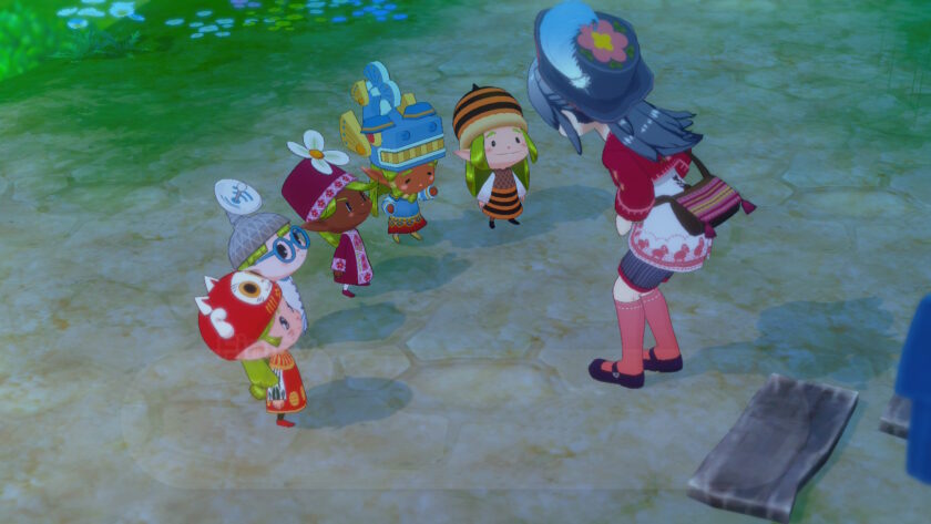 A screenshot from Story of Seasons: Grand Bazaar shows the female protagonist bending forward to greet five colourful, child-sized characters dressed in whimsical animal and flower-themed costumes. They stand on a stone path surrounded by soft green grass and glowing blue flowers. Each character wears a unique hat resembling a creature or plant, including a red dinosaur, a white sheep, a blue bird, a sunflower, and a bee. The scene is bright and playful, highlighting the game’s charming and imaginative style. Published on: LadiesGamers.