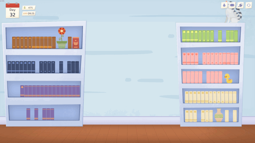 Scene of two colorful bookshelves against a light blue wall with a wooden floor. The left shelf holds books and decorations including a potted flower and a book with a cat illustration. The right shelf features books, a rubber duck, a decorative vase, and a partially visible cat sitting on top. A calendar in the top left corner shows “Day 32,” a balance of $475, and the time “AM 09:23.” Four icons appear in the top right corner, representing game controls. 